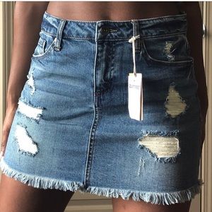 DISTRESSED DENIM MINI SKIRT